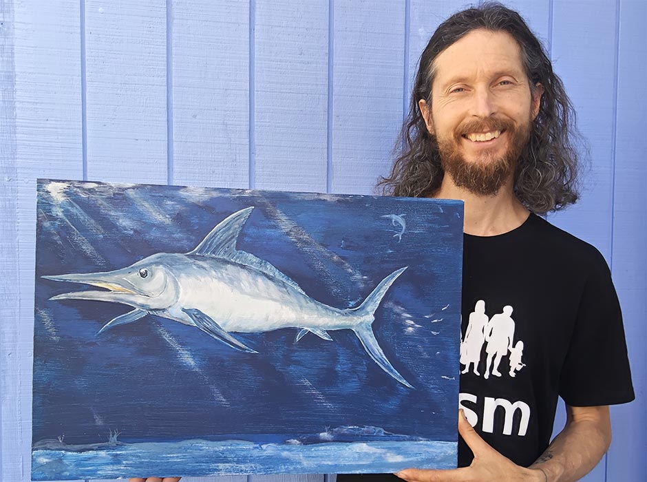 Researcher Seabourne Rust holds an artistic reconstruction of 'Zealandorhynchus fordycei'. Painting: S. Rust. Photo: D. Yanakopulos.