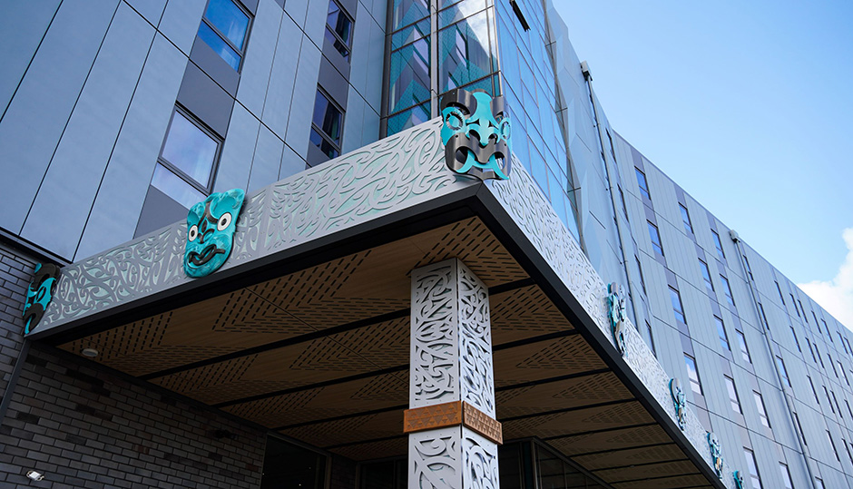 Te Rangihīroa College entrance, incorporating Māori design elements including koru and wheku