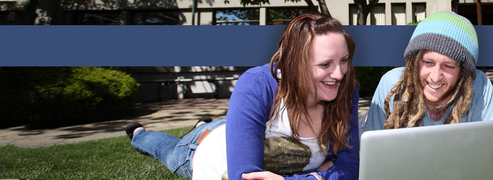 Two students looking at laptop