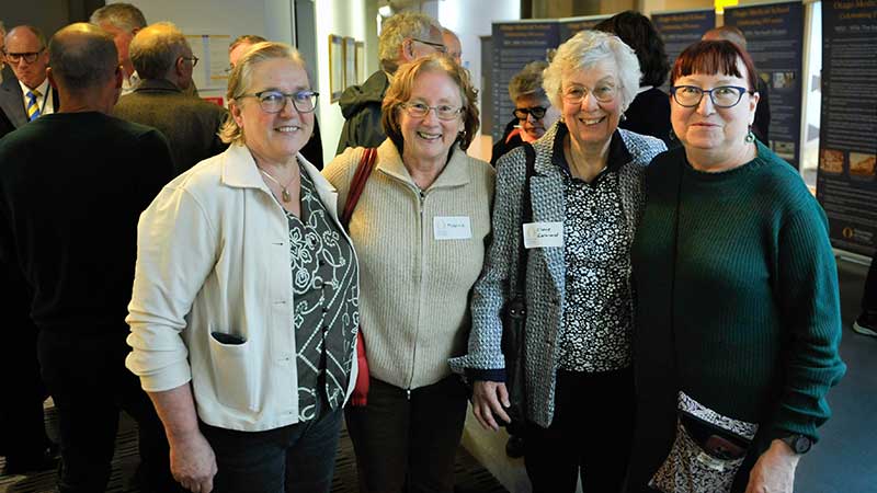 four women standing 