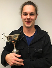 physio_cory glover from PSA holds trophy 2017