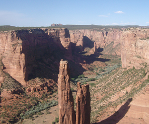 Spider Rock in Canyon de Chelly National Monument, Northern Arizona, carved by Monument Creek eroding into Permian aeolian sandstone.