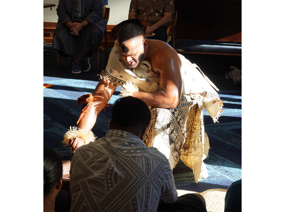 A man crouched on the ground 