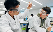 Two students working in the Chemistry lab