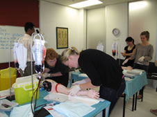 4th Year students practice venepuncture at UOC Simulation Centre during 2012 Introductory Fortnight