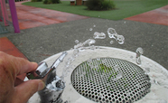 Drinking fountain with grass growing in it