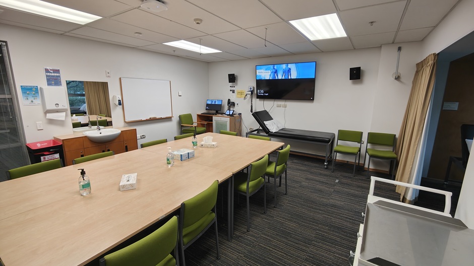Setup of Hunter Centre rooms HU102-3-5-6-8-9-11 showing chairs around a table, and medical equipment