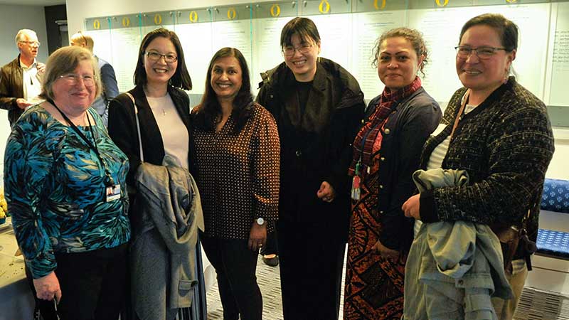 six women standing