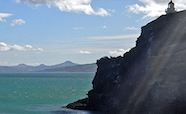 Coastal cliffs with lighthouse thumb