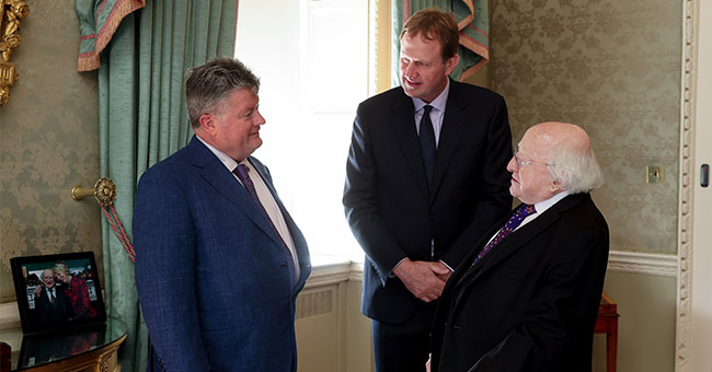 Liam Kennedy (left), with Irish Minister of Justice Jim O'Callaghan (centre) and former Irish President Michael D Higgins, at Liam's High Court appointment celebration at Áras an Uachtaráin (the official residence of the President of Ireland). 