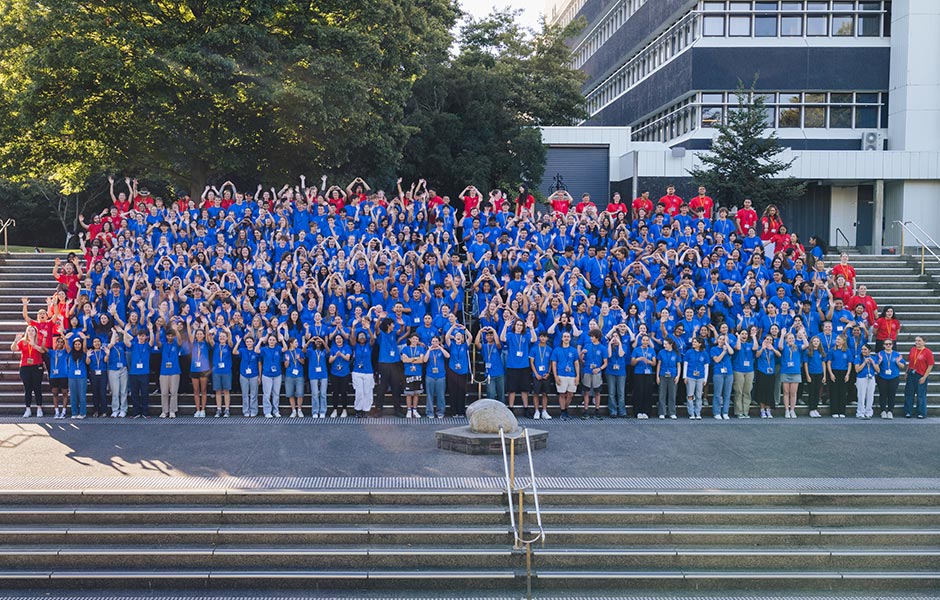 Group of students from Hands-On standing on stairs at Otago University