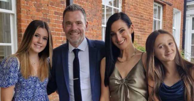 A family of four, mum dad and two daughters