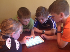 kids working on a tablet image