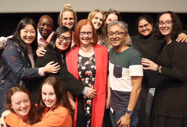 Stephanie Hughes surrounded by members of her research team image