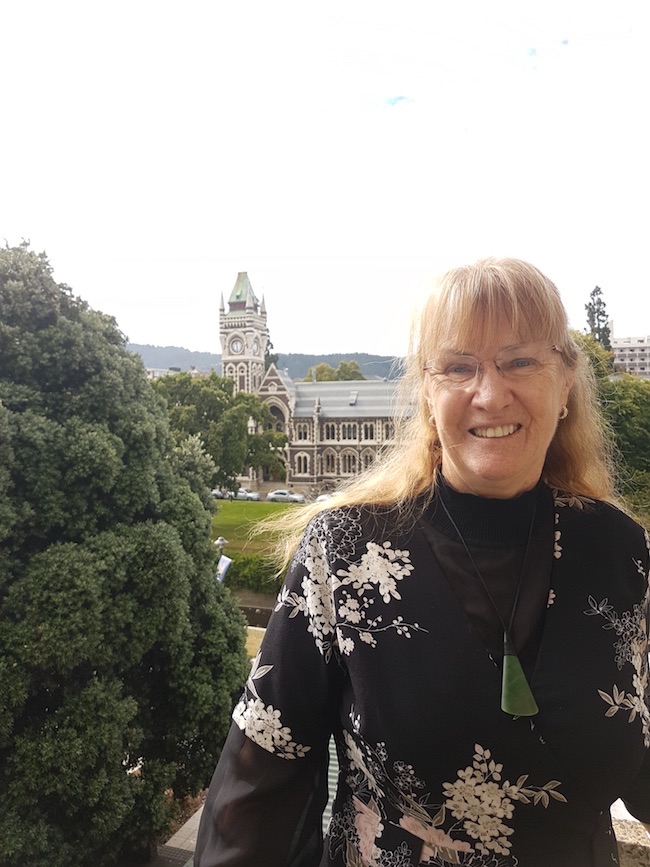 Photo of Dr Jillian Evans outside the University of Otago clocktower.