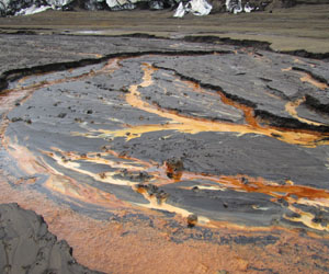 Active dewatering along the 2011 Grímsvötn eruption crater margins coupled with weak geothermal activity gives rise to a myriad of orange hues as tephra undergoes palagonitization and clay alteration, Vatnajökull, Iceland.