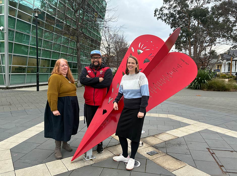 Professor Sarah Wakes (Mathematics), Senior Lecturer Edmond Fehoko (Human Nutrition), and Professor Katherine Black (Human Nutrition) stand infront of artwork on the Otago University Campus.   