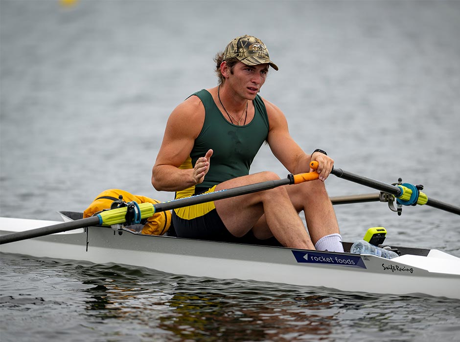 A man rows on the water.
