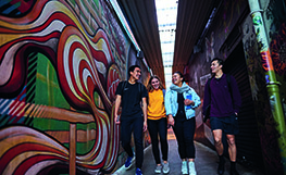 Four students by Dunedin wall art
