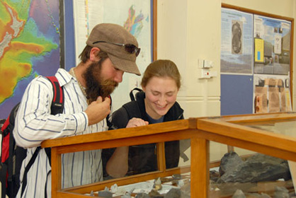 students in the geology museum looking at displays
