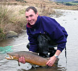 Ed Waite with a large Brown trout (M.Sc research on trout  
  migration)