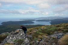 Hamish Lilley examines mineralised schist containing W and Sn above Port Pegasus, Stewart Island.