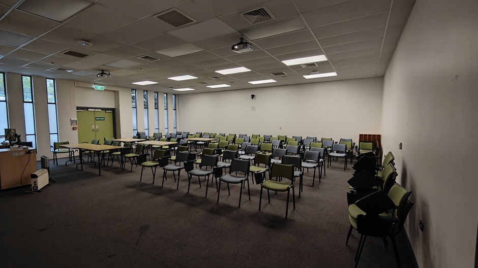 View of 71 Frederick St room 71FRG10 showing tables and chairs with individual writing surfaces
