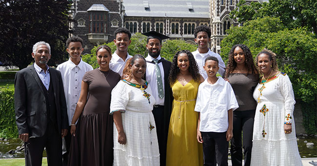 Biruk Legesse, centre, with his extended family ahead of his graduation on Saturday.