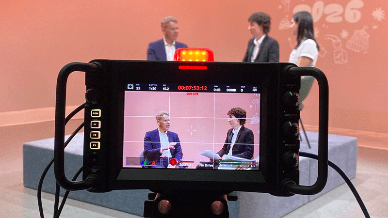 watching an interview through a camera