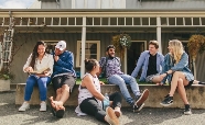 Students relaxing outside Caroline Freeman College