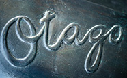 Otago written in bronze part of the Pathways sculpture image