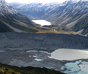 Southern Alps glacial landscape with moraines and terminal lakes of the Mueller Glacier (foreground) and the Hooker Glacier in the distance.