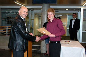 Blake Henley receiving his award from Professor Mike Hunter