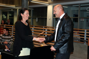 Class of 1979 Undergraduate Medical Scholarship recipient Sara Trafford receiving her award from Professor Mike Hunter.