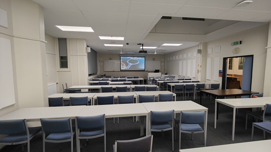View of Surveying Building room G10 showing rows of tables and chairs