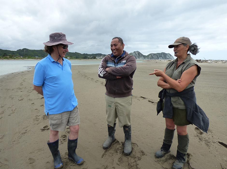 Hamish Spencer interacts with community members on the estuary at Tolaga Bay in Tairāwhiti. Photo: Mark Coote