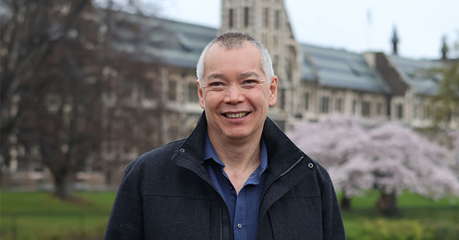 A man is pictured with the Clocktower in the background.