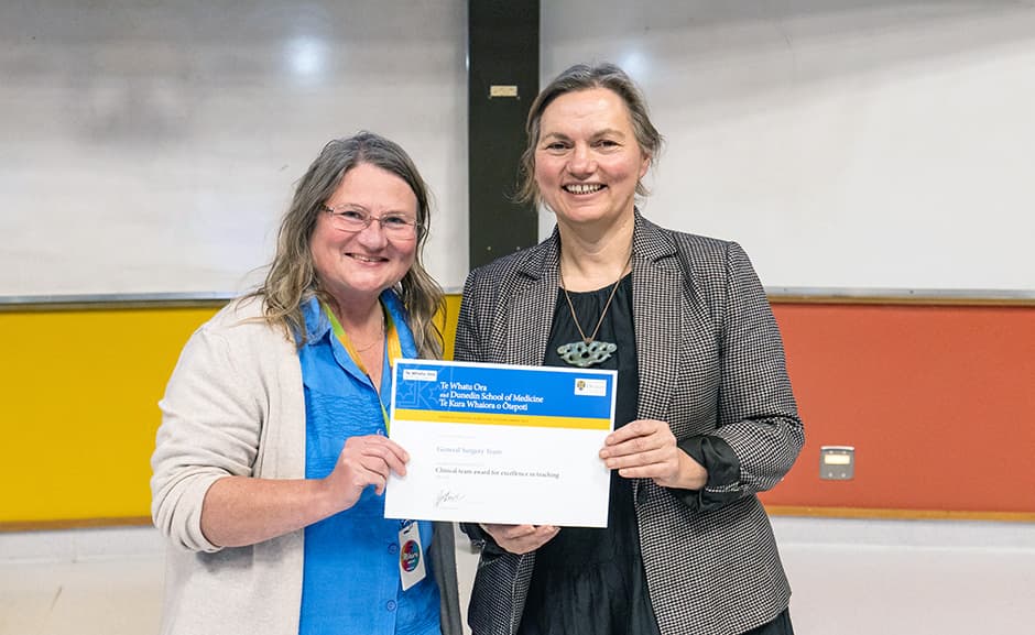 The Head of the Department of Surgical Sciences, Dr Jo Krysa (left), is delighted to receive the Clinical Team Award for Excellence in Teaching on behalf of the General Surgery team. Presenting the award is Dunedin School of Medicine Dean Professor Jo Baxter.