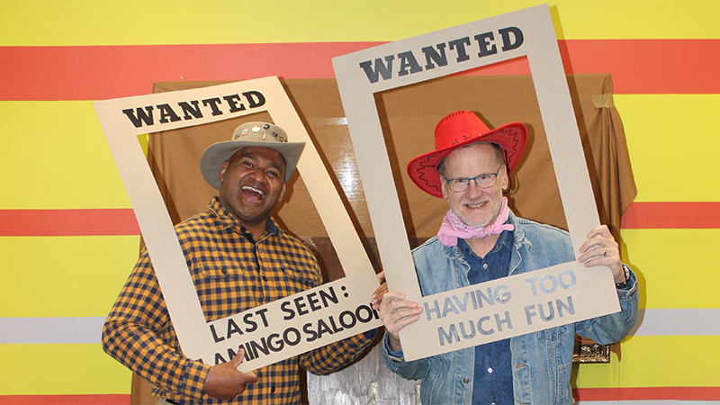 hris Addington and Eric Nabalagi dressed in country western costumes