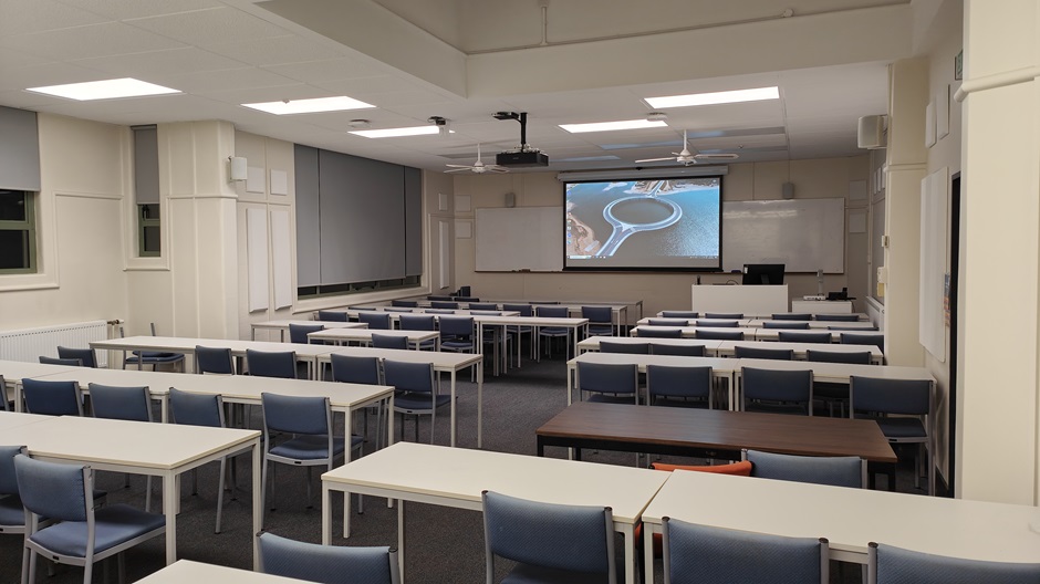 View of Surveying Building room G10 showing rows of tables and chairs