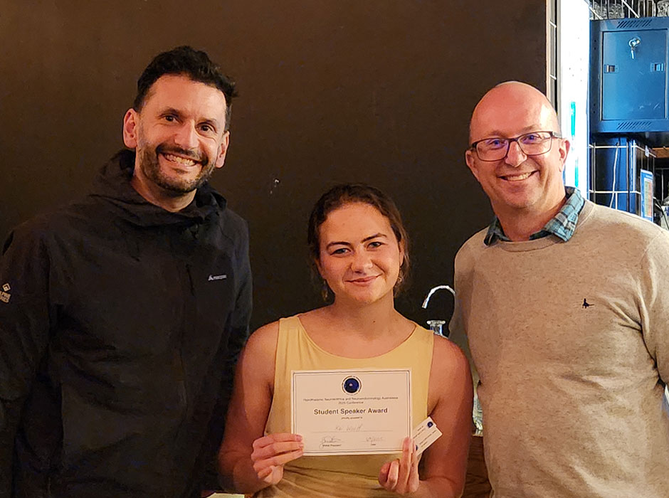 Dr Karl Iremonger, Kai Woolf and Hypothalamic Neuroscience and Neuroendocrinology Australasia President Professor Zane Andrews with her awards received at the recent Medical Sciences Congress in Christchurch. 