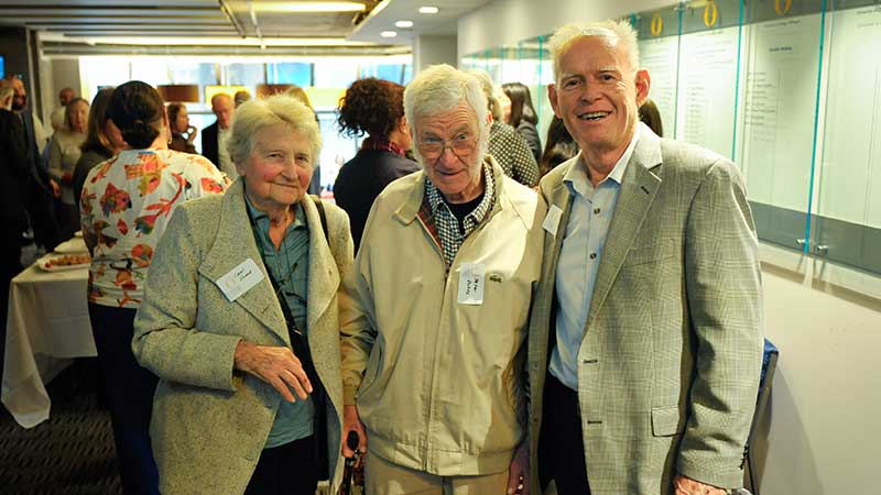 three people standing