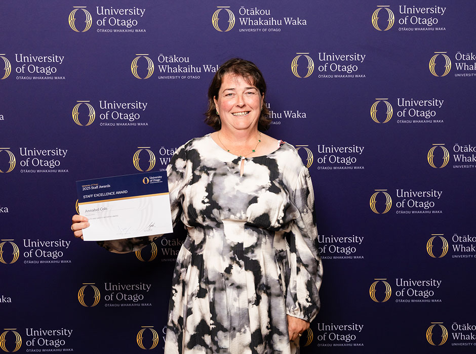 a woman holding a certificate