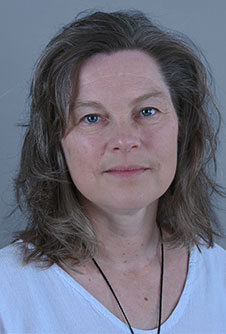 head and shoulders of a woman with shoulder length dark hair