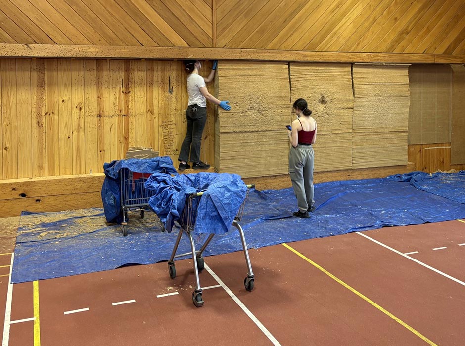 People work to demolish an old archery world.