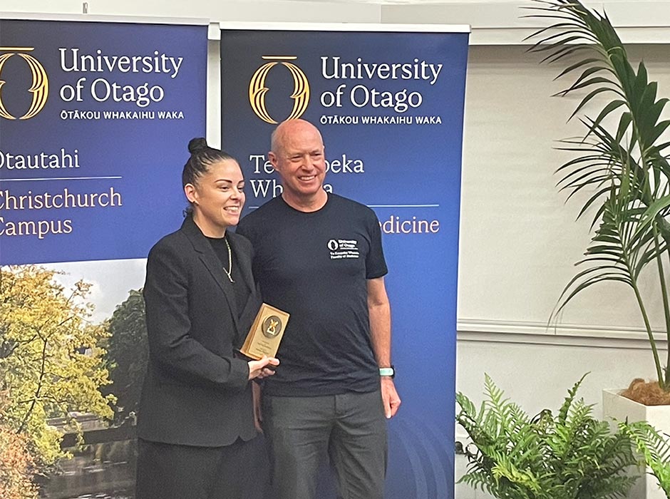 Professor-Lutz-Beckert-and-Amber-Philpott holding an award