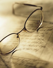 Photo of eye glasses on open notebook