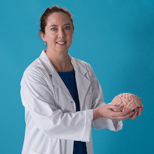 Dr Louise Parr-Brownlie holding a brain