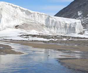 Not-so-Dry Valleys:  At the height of Antarctic summer, Commonwealth Stream drains the Commonwealth Glacier, Taylor Valley, Antarctica