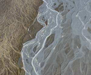 An aerial view of the spectacular braids of the Murchison River near Mt Cook. The river's blue hue is typical of glacially-fed rivers